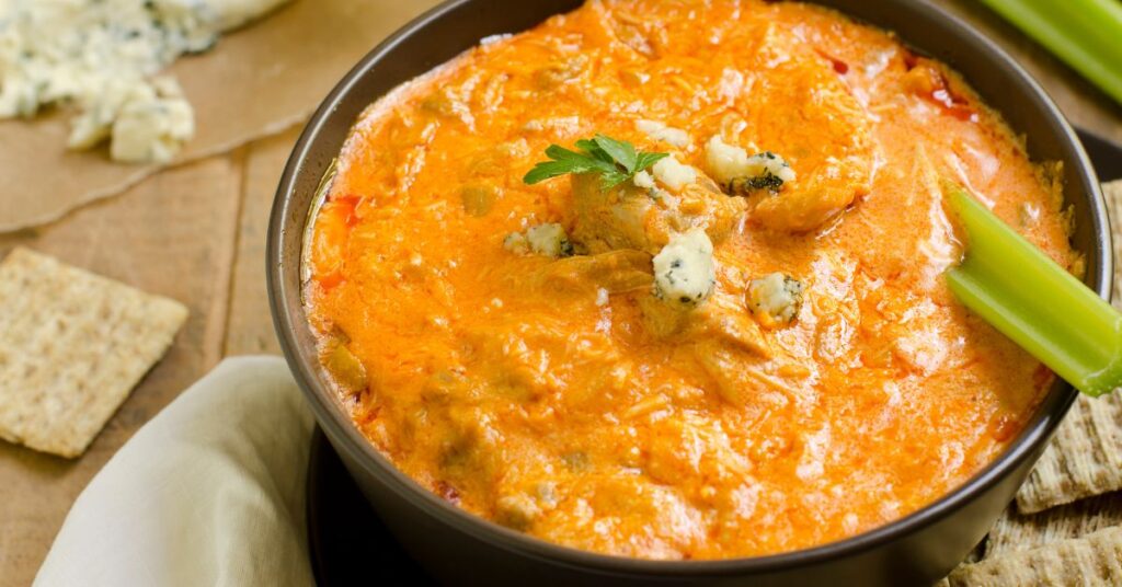 Weight Watchers-friendly buffalo chicken dip made with Greek yogurt, chicken, ranch mix, and buffalo sauce.