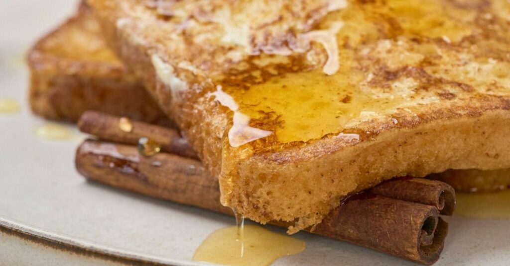French toast with cinnamon and syrup on a plate, WW friendly breakfast