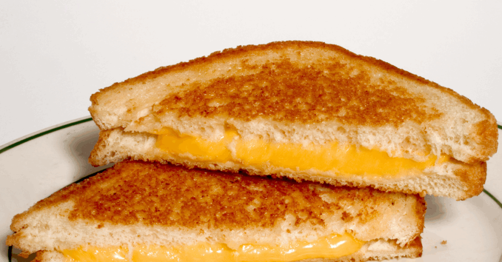Low point grilled cheese sandwich made with Velveeta and Sara Lee 45-calorie bread, served golden and crispy in a pan.