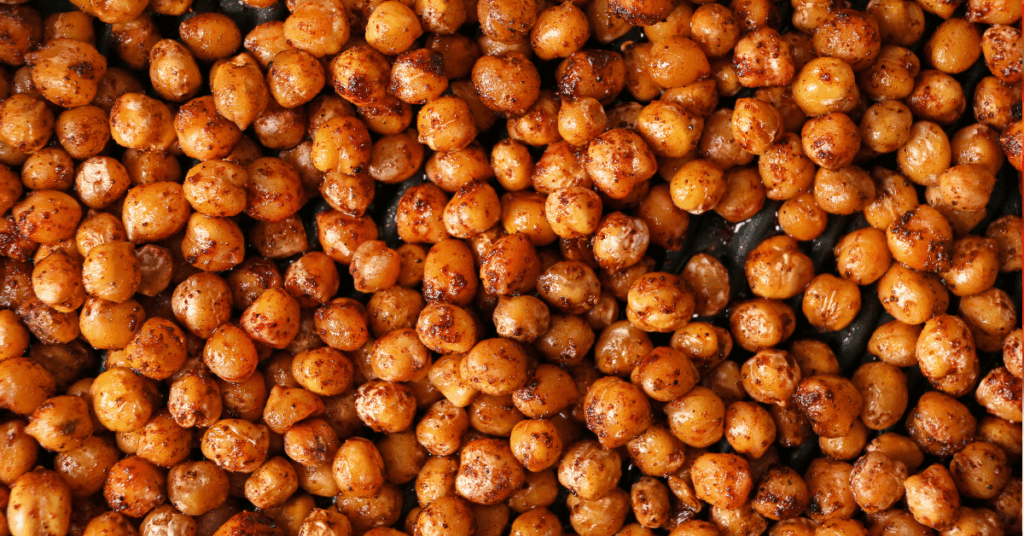 A bowl of crispy golden chickpeas seasoned with smoked paprika and garlic powder.